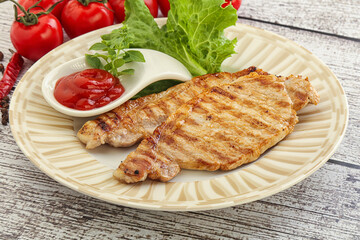 Grilled pork steak with ketchup