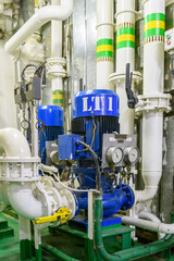 Obraz premium Water pump on ship. Engine room interior on big vessel.