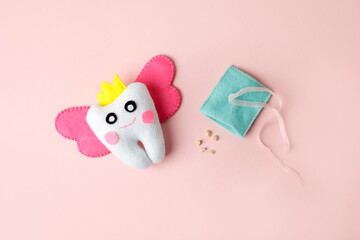 Tooth fairy with magic wings and crown on pink background, greeting card with copy space Happy Tooth Fairy Day on February 28th or 22 august, healthcare, kids oralcare concept