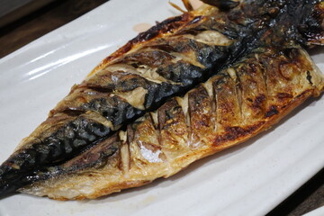 Korean food. Grilled mackerel on a plate