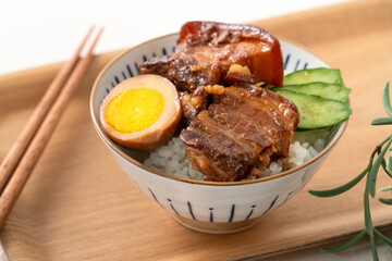 Braised pork belly meat over cooked rice, famous and delicious street food in Taiwanese restaurant.