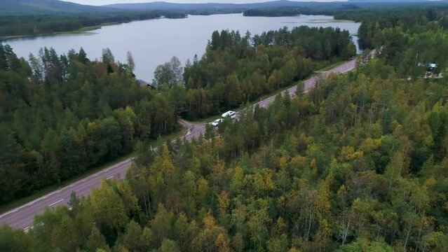 Caravan Camping driving on E45 Higway Road through the wilderness of middle Sweden between the towns of Malung and Oje