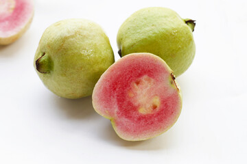 Fresh pink guava on white background.