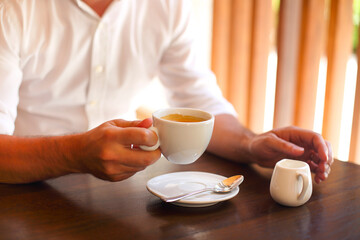 Cropped shot of young businessman with coffee