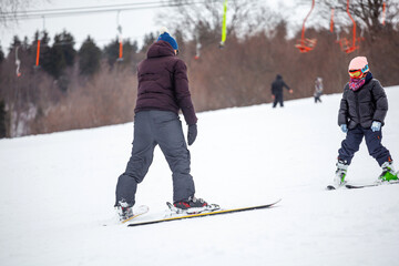 A coach teaches how to ski, the famous winter resort of Bakuriani