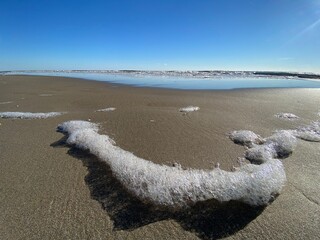 foam on the beach - 702213804