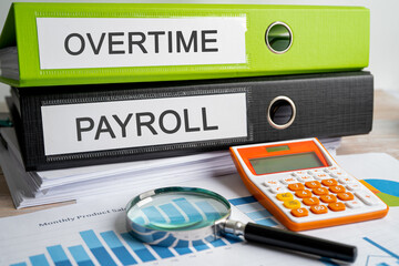 Overtime, Payroll. Binder data finance report business with graph analysis in office.
