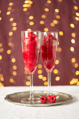 Rasperry sorbet with champagne in long glasses. Valentines Day