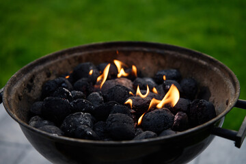 Smoldering coals in the grill. Burning coals for barbecue during a picnic