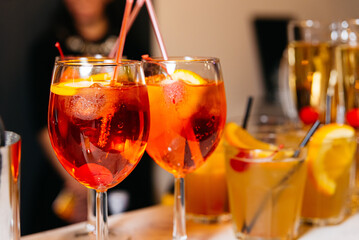 Aperol Spritz Cocktails Close-up with Garnishes. Close-up of refreshing Aperol Spritz cocktails...