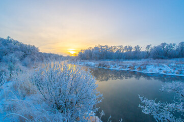 Experience the magic of a winter wonderland. Watch the sun rise over the frozen river. Be captivated by beauty and whimsy.