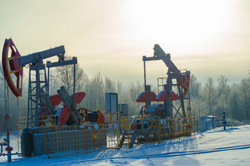 Pumpjack Contains mesmerizing images of oil pumps against a glittering frost background. Captures...