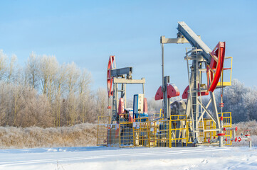Fototapeta na wymiar Pumpjack Enjoy the mesmerizing beauty of oil pumps against a backdrop of glistening frost. Oil fields inspired by nature, with magical landscapes.