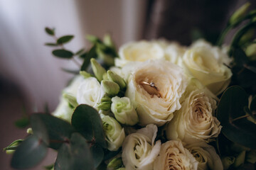 Wedding rings on the bride's bouquet