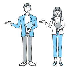 案内をするビジネスパーソンの男性と女性