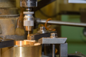 The drilling process on NC milling machine with brass material.