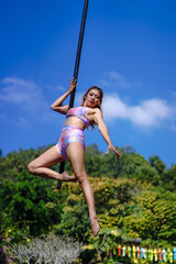 Beautiful Asian girl shows extreme advances by performing pole dance aerial in various positions...