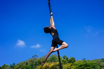Beautiful Asian girl shows extreme advances by performing pole dance aerial in various positions...