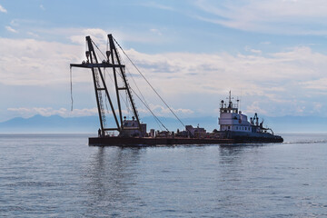 Floating crane as water industrial transport.