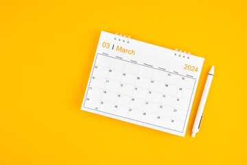 March 2024, Monthly desk calendar for 2024 year and pen.