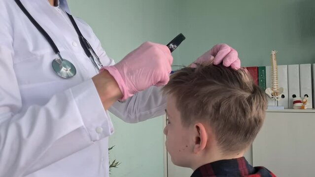 Trichologist holds magnifying glass checking hair of children and teenagers. Medic rips off guy head and hair