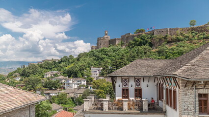 Fototapeta na wymiar Panorama showing Gjirokastra city from the viewpoint with the fortress of the Ottoman castle of Gjirokaster timelapse.