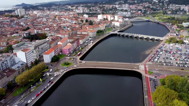 Panoramic aerial view of Pontevedra city. Famous travel destination in Galicia. River Lerez. Bridges over the river.  Drone going forward above the river. Beautiful panorama of all region