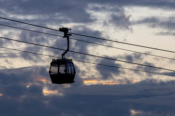 2023 Dec 30,Hong Kong.Ngong Ping 360 cable car on Tung Chung ,Lantau Island, Hong Kong. Cable car just leave the Tung Chung City.