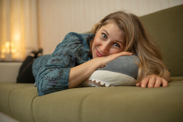 Obraz premium Portrait of a young beautiful blonde girl at home..