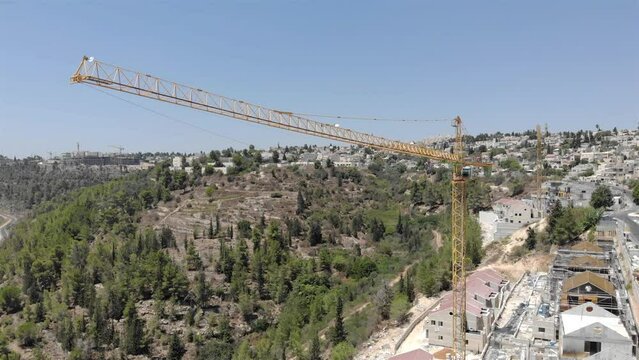 Crane and Construction Site at Jerusalem Hills-Aerial
Drone view over Building Site with Crane at Jerusalem Hills, Israel
