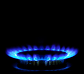 flames of gas stove in the dark