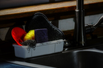 A typical Kitchen scene in almost every American household. A colorful collection of scrubbers,...