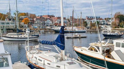 New England Harbor:  Yachts, fishing boats and sailing ships gather in Camden, Maine on an October...