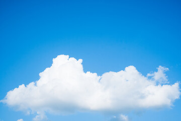 Naklejka na ściany i meble Large white cloud on clear blue sky background with copy space, Nature view white cloud on the plane