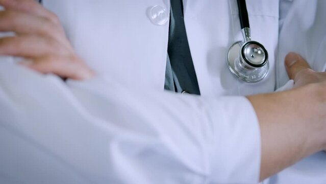 doctor with stethoscope. doctor's white coat standing confidently with his arms crossed. Concept of trusted doctor and health insurance