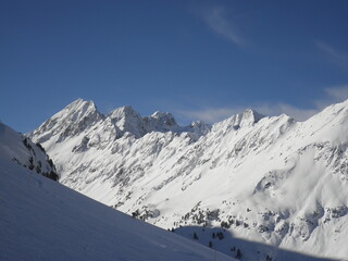 Fototapeta na wymiar Wild Snowy peaks in Alps