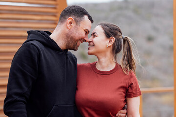 Fototapeta premium Attractive man and beautiful woman look at each other and smile