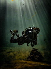 Sunbeams illuminate a local diver in the open water basin at Royal Springs, Suwannee County, Florida