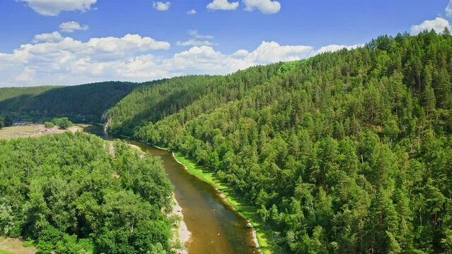 River Agidel. Aerial view of river surrounded by green forest and mountains