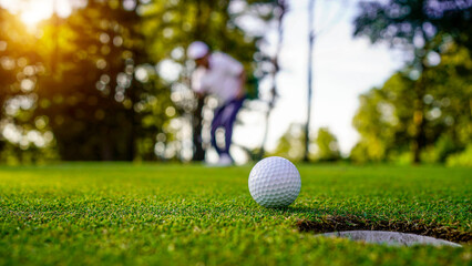 Golfers are putting golf in the evening golf course golf backglound.