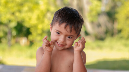 Portrait of a happy and smiling child with Down syndrome.