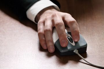 Computer mouse in hand businessman
