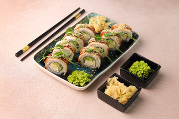 Assorted sushi nigiri and maki big set on slate. A variety of Japanese sushi with tuna, crab, salmon, eel and rolls. Top view