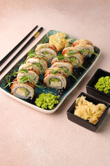 Assorted sushi nigiri and maki big set on slate. A variety of Japanese sushi with tuna, crab, salmon, eel and rolls. Top view