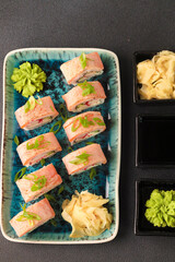 Assorted sushi nigiri and maki big set on slate. A variety of Japanese sushi with tuna, crab, salmon, eel and rolls. Top view