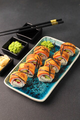 Assorted sushi nigiri and maki big set on slate. A variety of Japanese sushi with tuna, crab, salmon, eel and rolls. Top view