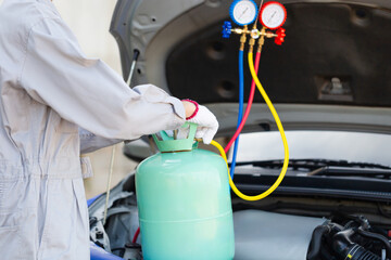 Car Air Conditioning Repair, Repairman check and fix car air conditioner system, Technician man checks car air conditioning system refrigerant recharge