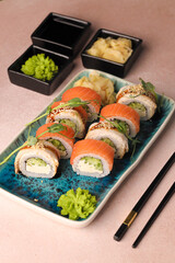 Assorted sushi nigiri and maki big set on slate. A variety of Japanese sushi with tuna, crab, salmon, eel and rolls. Top view