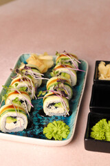 Assorted sushi nigiri and maki big set on slate. A variety of Japanese sushi with tuna, crab, salmon, eel and rolls. Top view