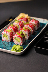 Assorted sushi nigiri and maki big set on slate. A variety of Japanese sushi with tuna, crab, salmon, eel and rolls. Top view